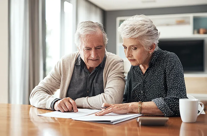 Elderly couple writing a will