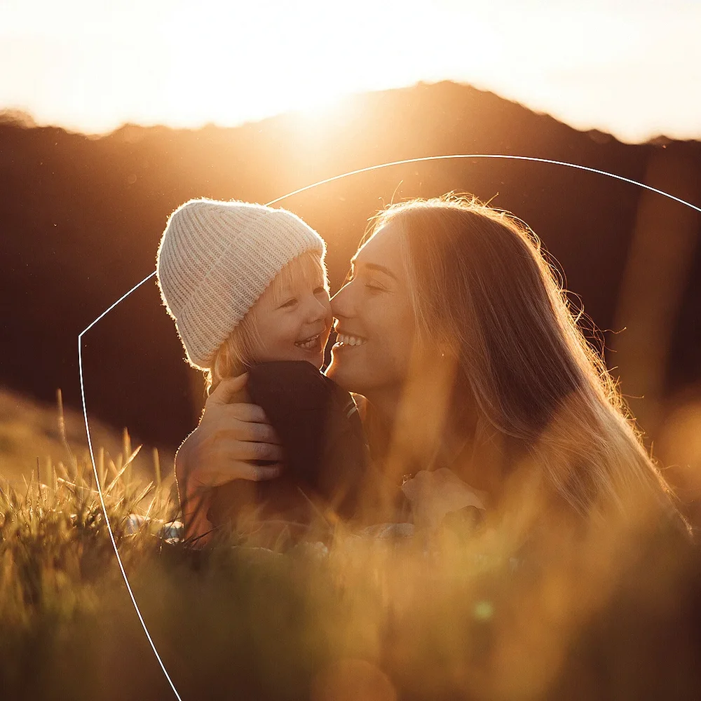 RSS Woman and her child in a feild at sunset