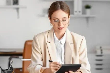 Woman looking at her notes during an interview