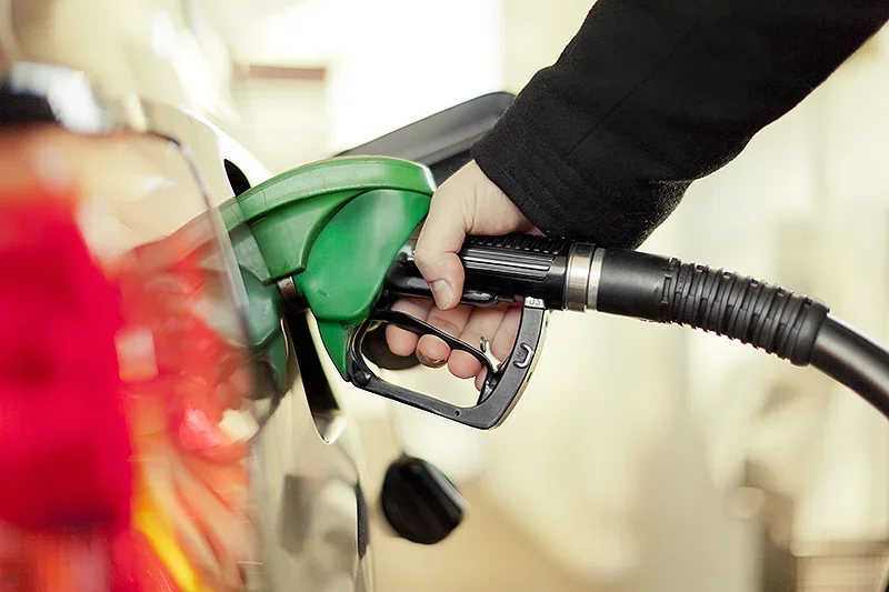 Someone filling up a car with petrol