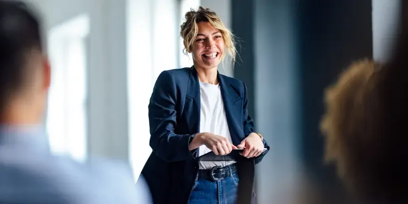 Woman looking happy holding clipboard